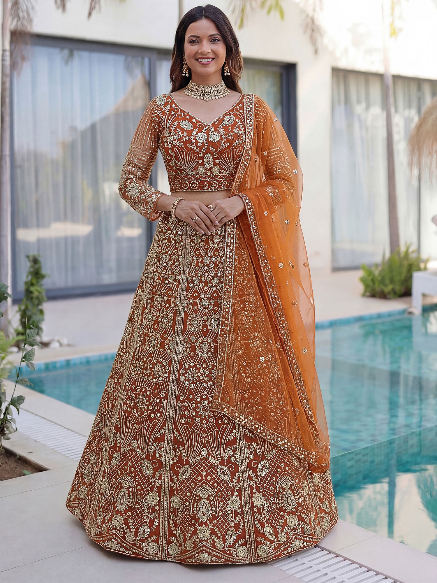 Orange Sequins Work Augmented Lehenga Choli