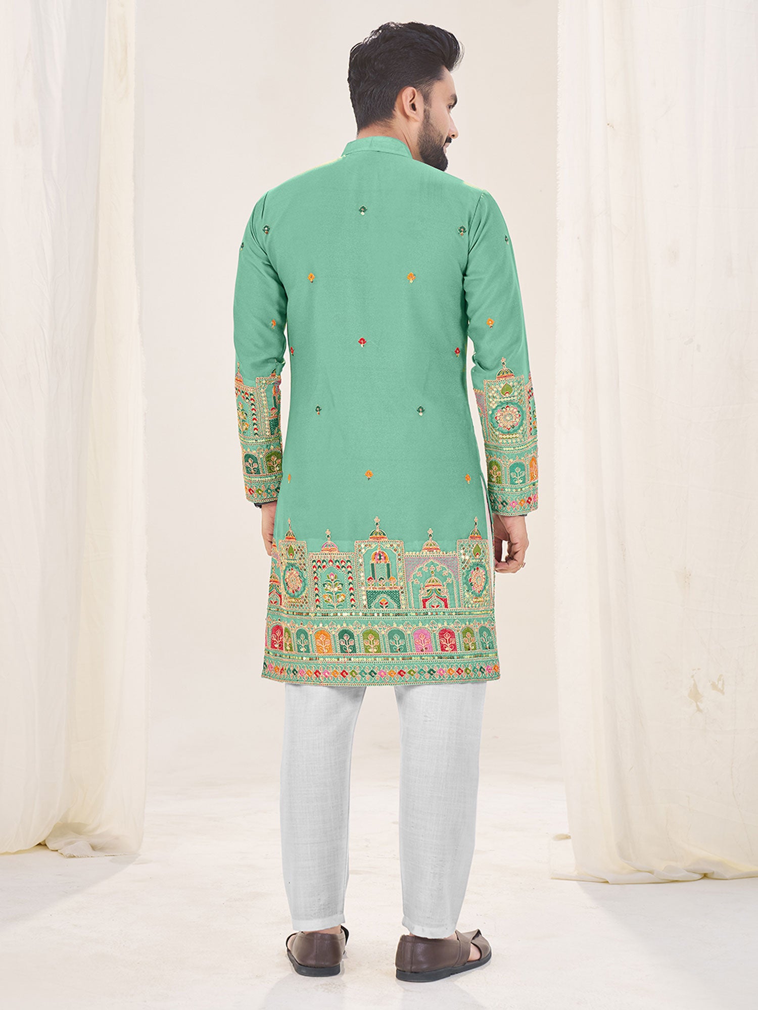Turquoise Sequins Augmented Kurta Set In Georgette