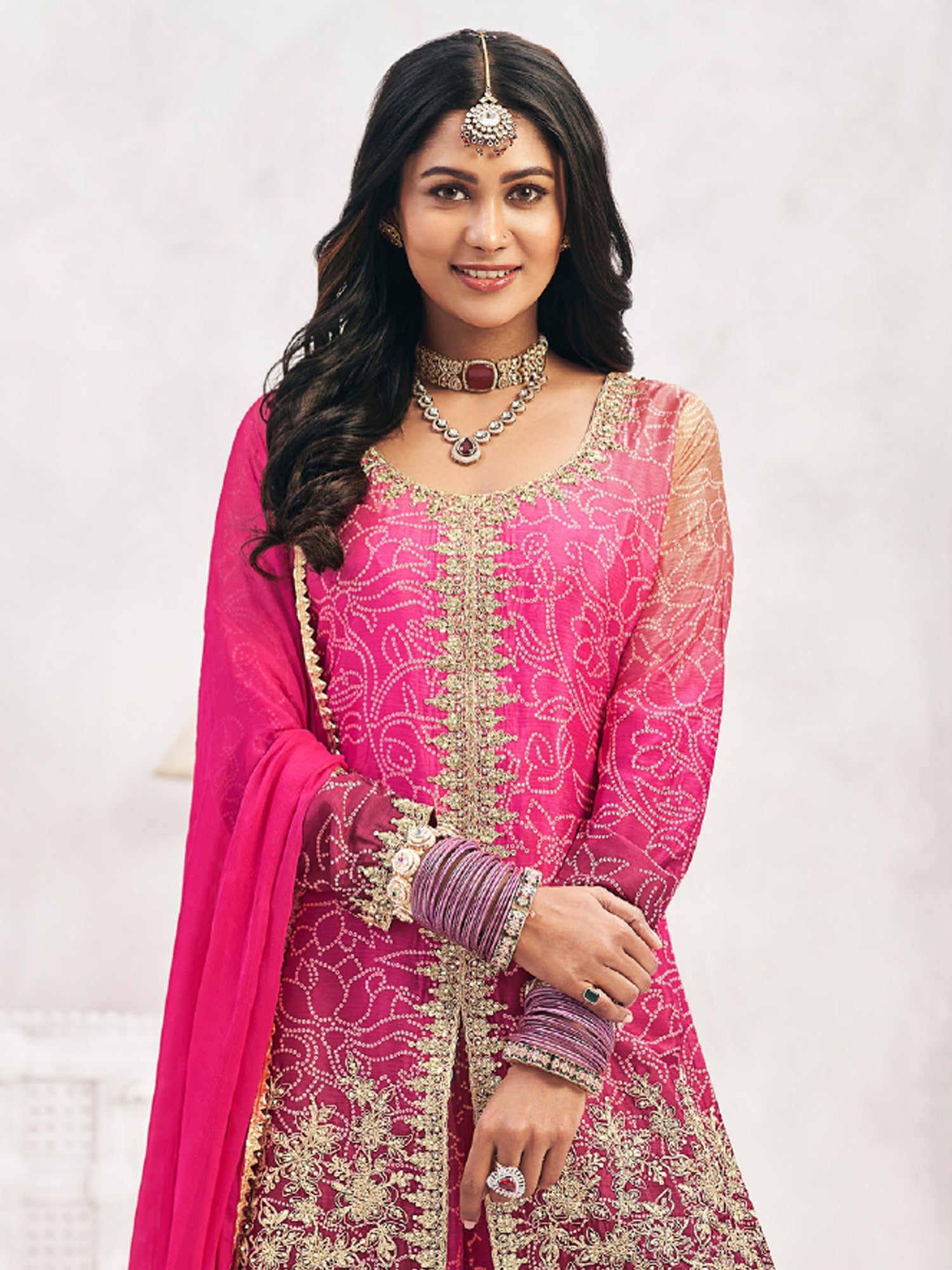 Pink And Purple Palazzo Style Suit In Bandhej Print