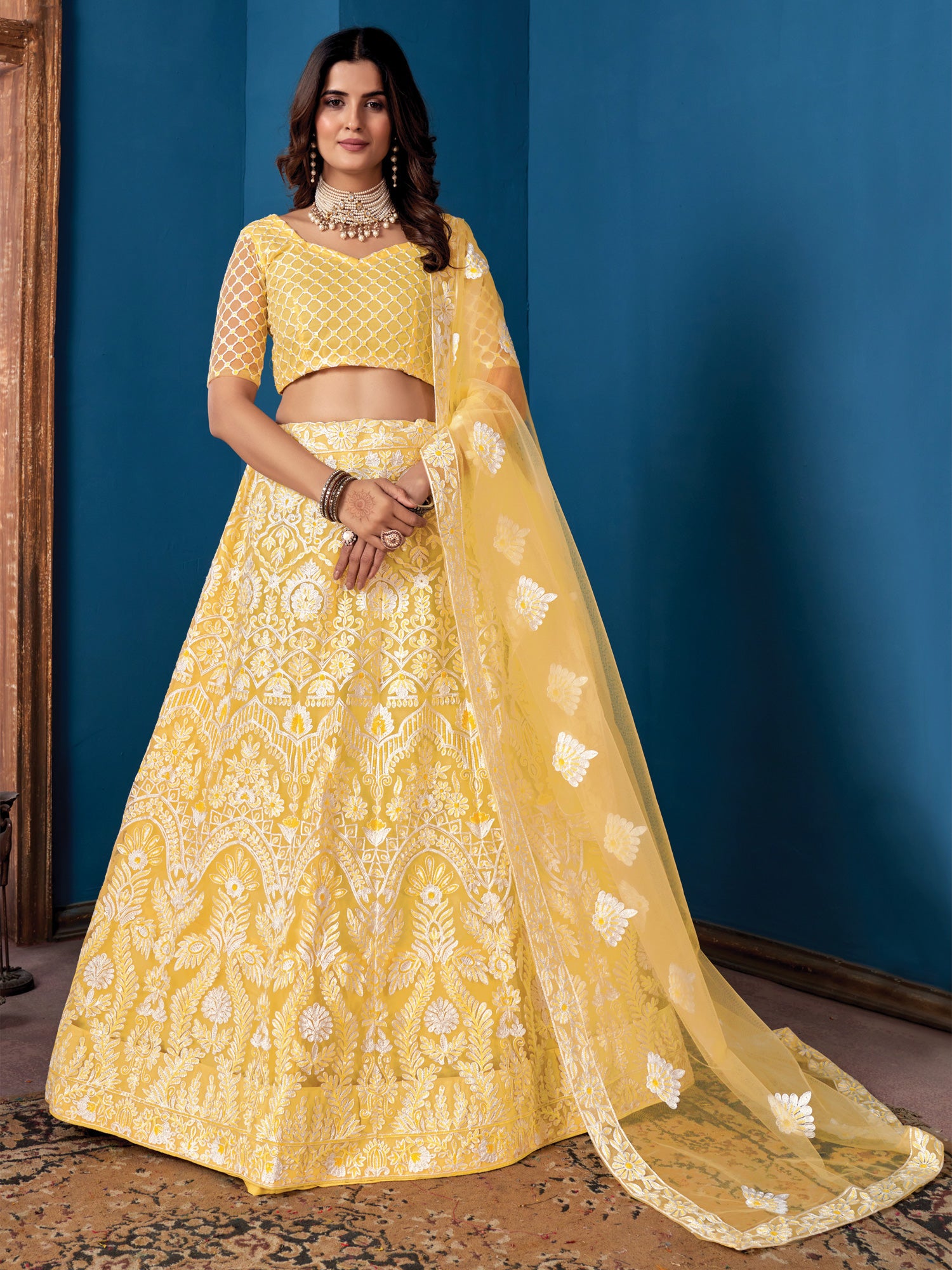 Yellow Heavy Thread Embroidered Lehenga Choli In Net
