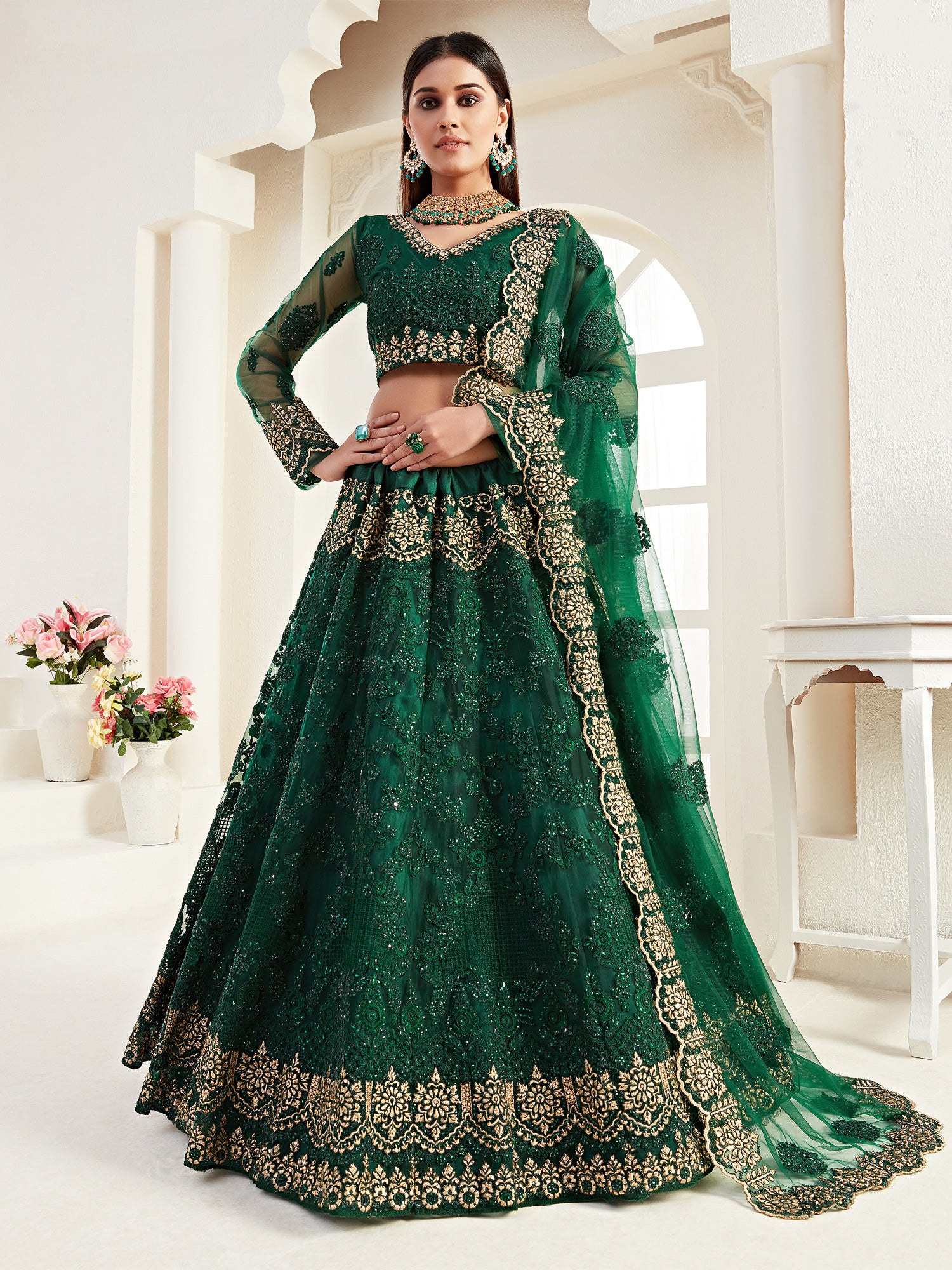 Dark Green Stone Work Enhanced Lehenga Choli In Net