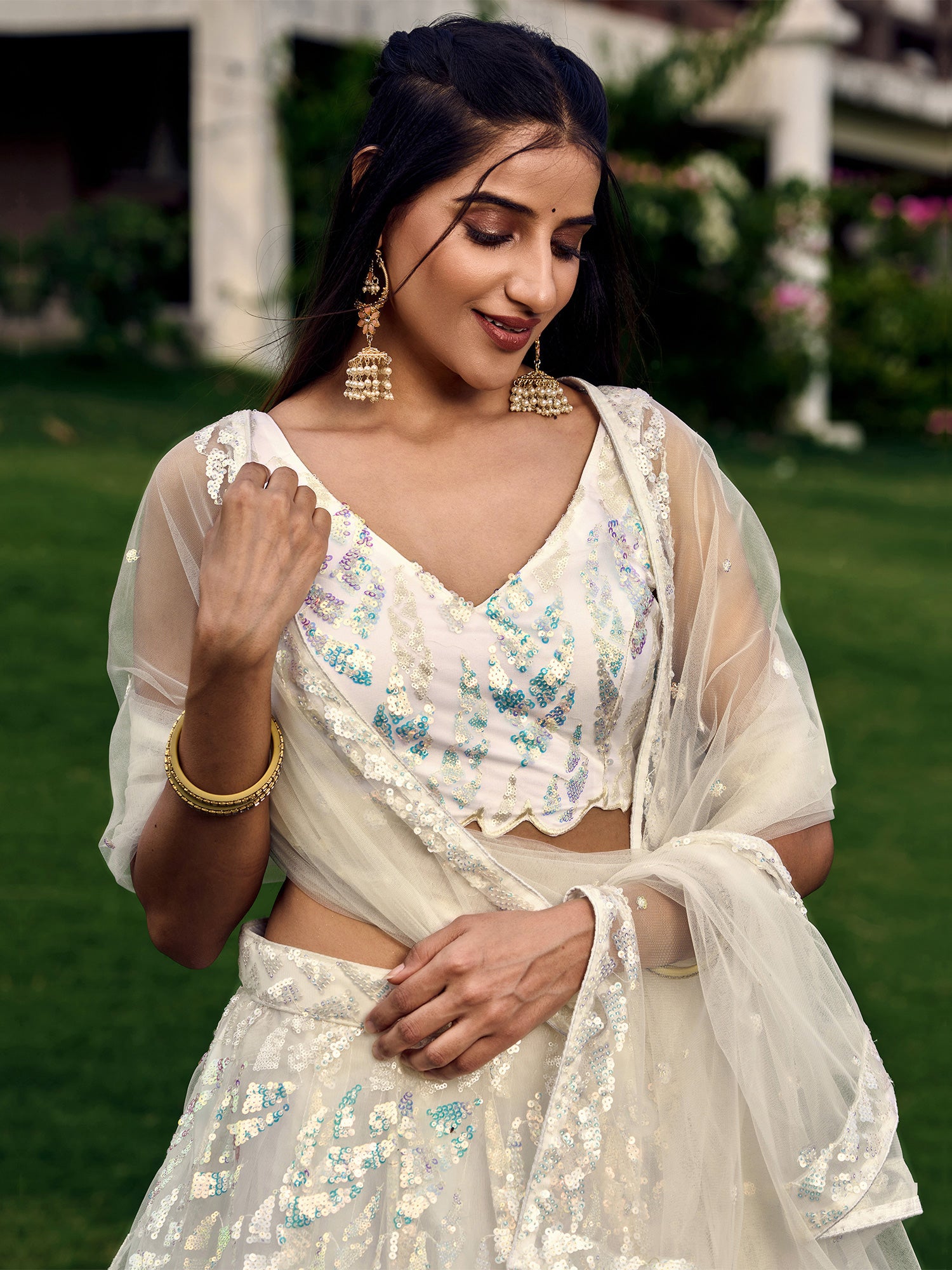White Party Wear Sequined Embroidery Lehenga Choli In Net