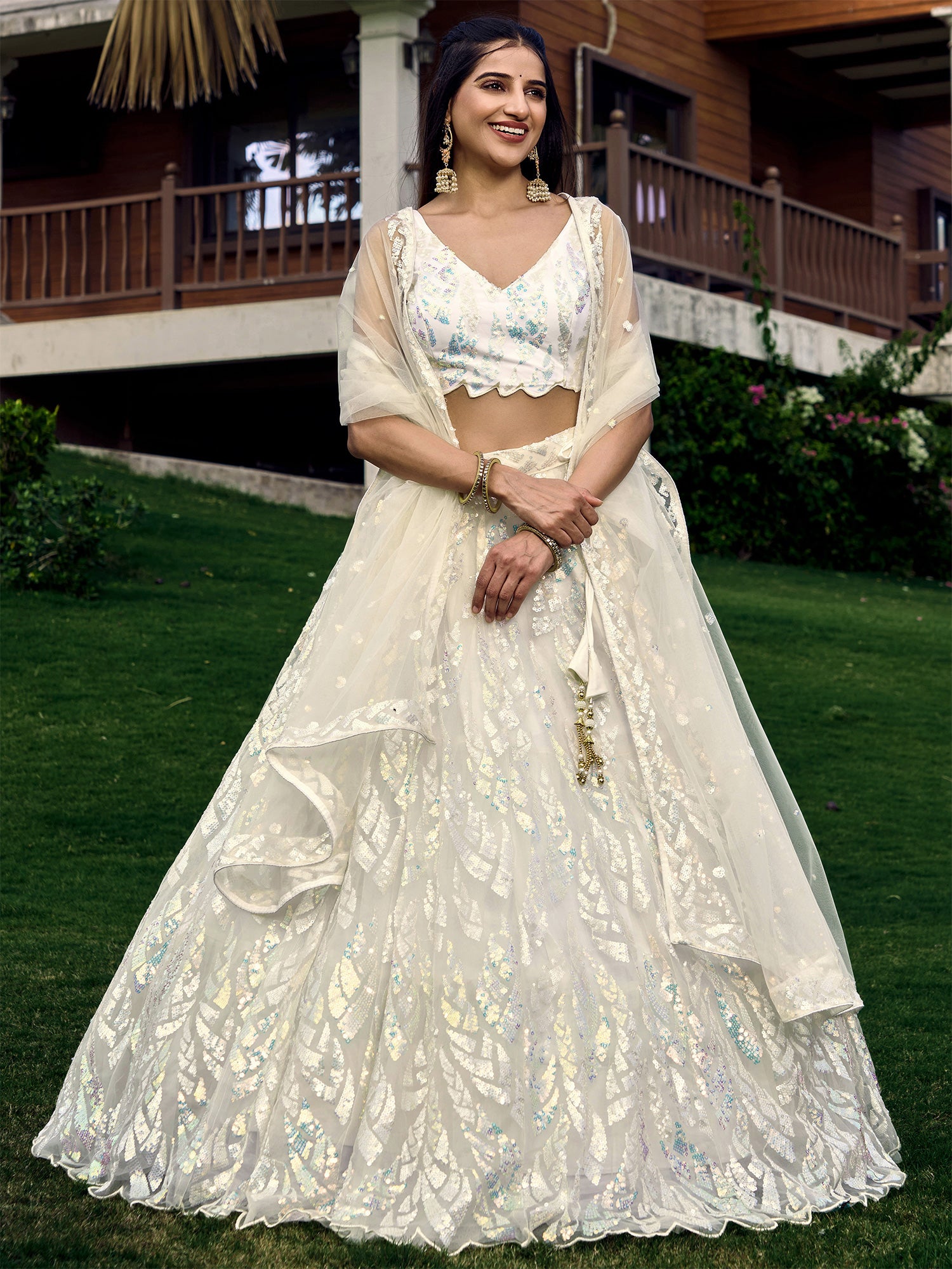 White Party Wear Sequined Embroidery Lehenga Choli In Net