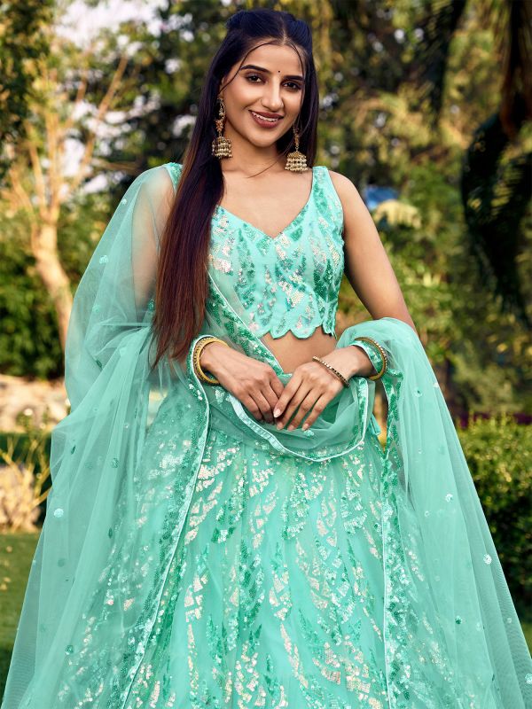 Turquoise Heavy Sequins Embroidered Lehenga Choli In Net