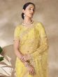 Yellow Floral Thread Embroidered Saree In Net