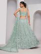 Green Sequins Enhanced Lehenga Choli In Net