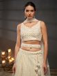 Off White Heavy Embroidered Net Lehenga Choli