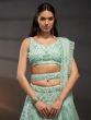 Turquoise Sequins Augmented Net Lehenga Choli