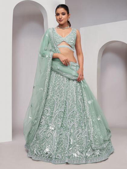 Green Sequins Enhanced Lehenga Choli In Net